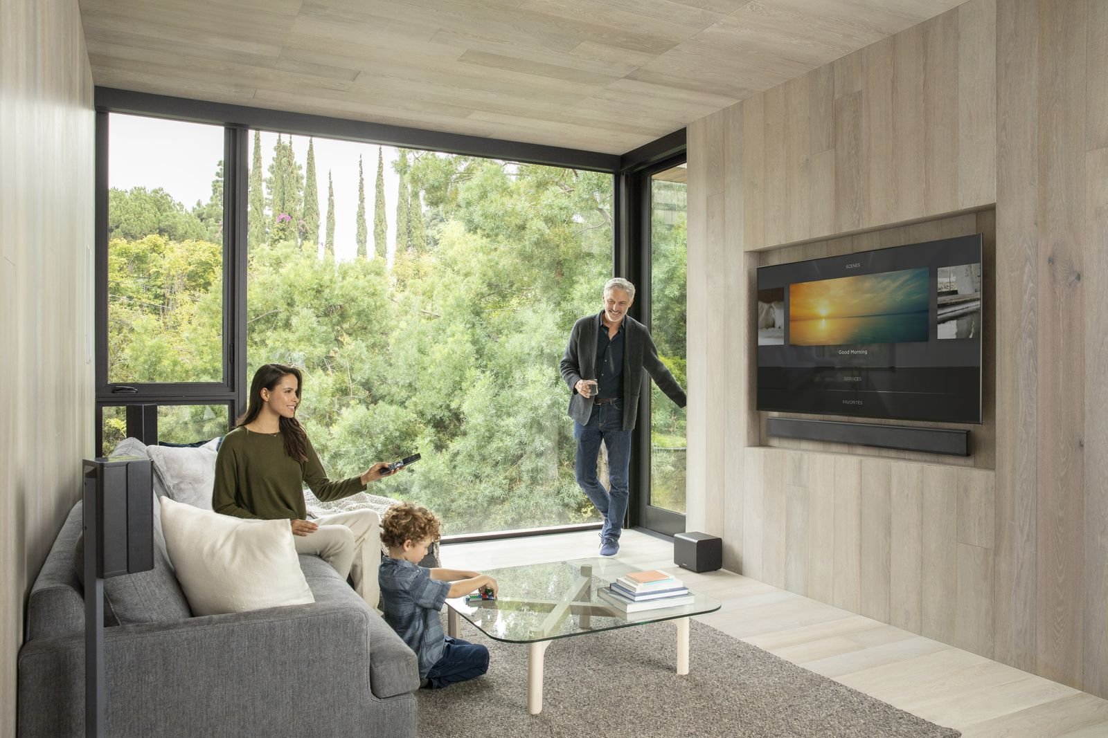 Family enjoying whole-home music in a bright living room
